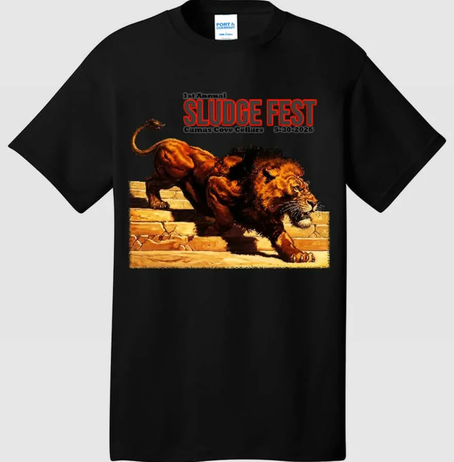 Mockup of a black Sludge Fest Year One shirt with the front print: a lion prowling down stone steps beneath 1st Annual Sludge Fest, Camas Cove Cellars, 5-30-2026