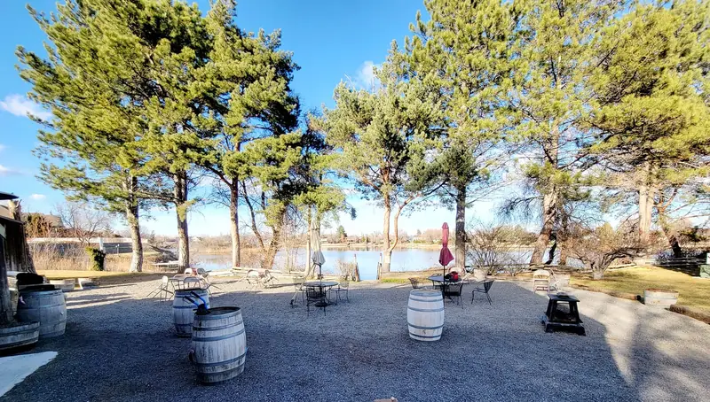 Wine-barrel tables with the lake behind